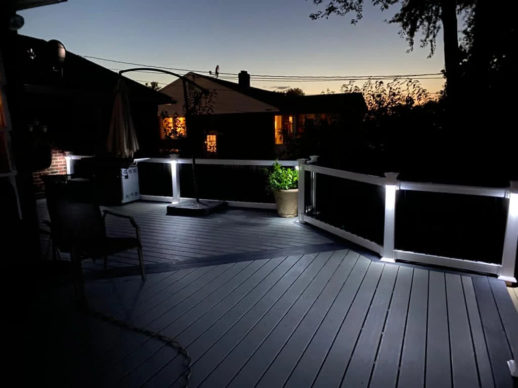 Deck railing and lights at dusk