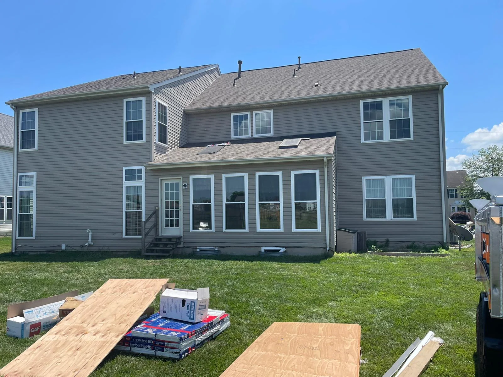 Rear of a home during deck and exterior work