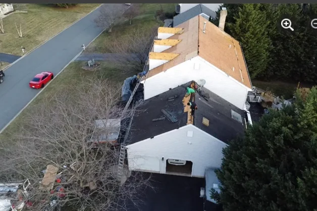 Aerial view of a roofing crew at work