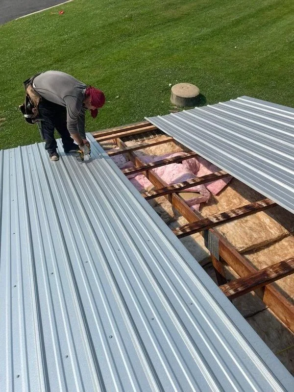 Worker on a residential roof during installation