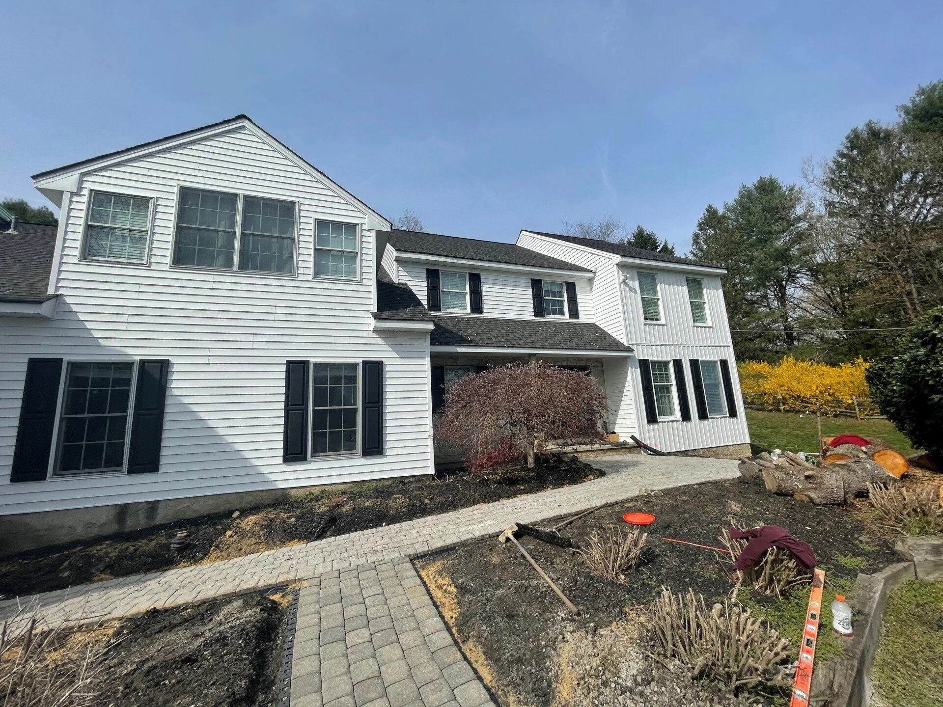 White home exterior with landscaping work in progress